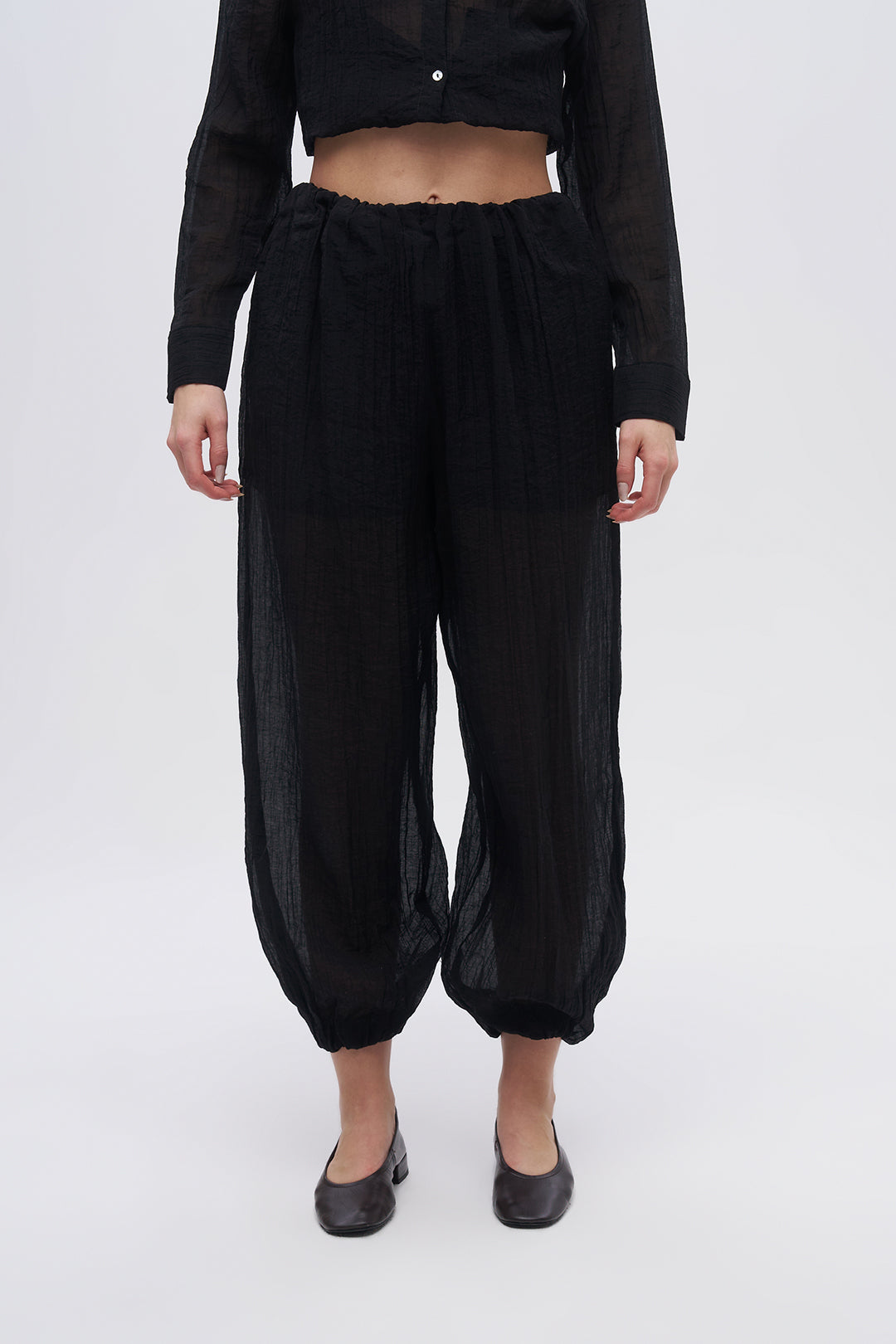 Beli ve Paçası Lastikli Dokulu Balon Pantolon Siyah