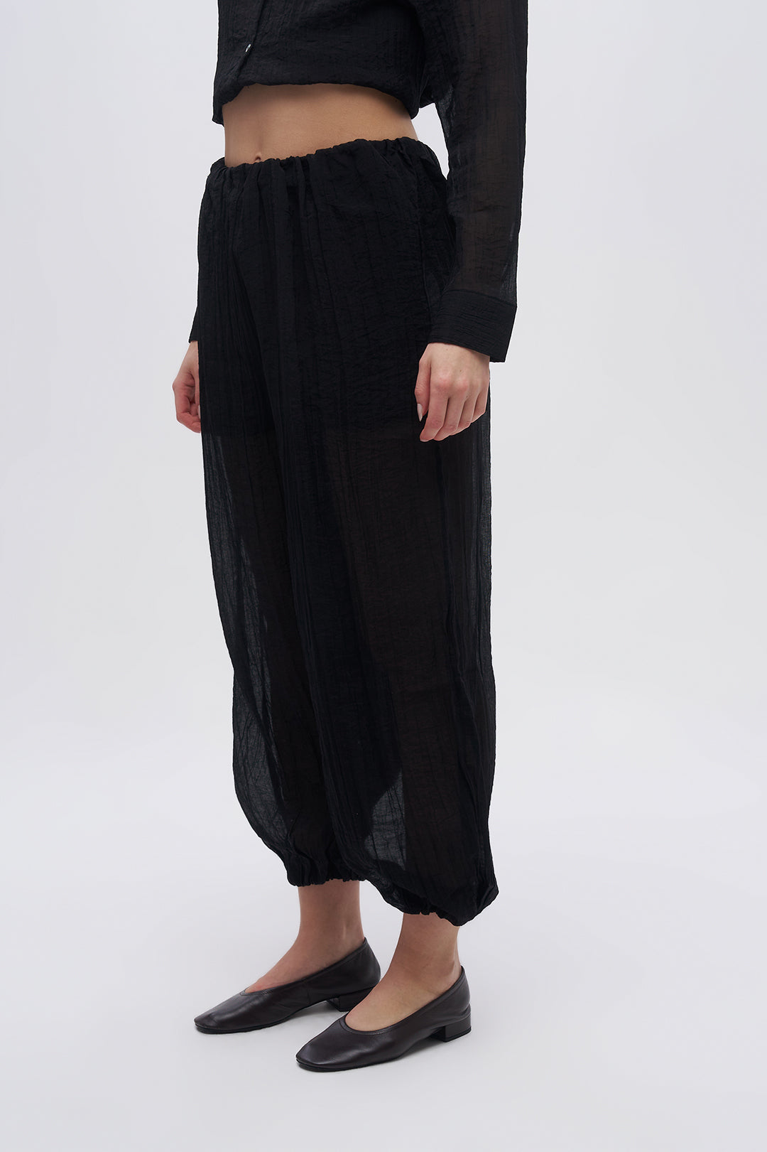 Beli ve Paçası Lastikli Dokulu Balon Pantolon Siyah