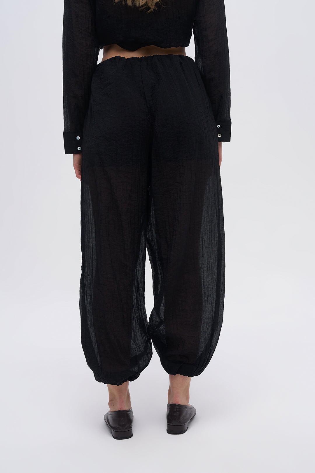 Beli ve Paçası Lastikli Dokulu Balon Pantolon Siyah